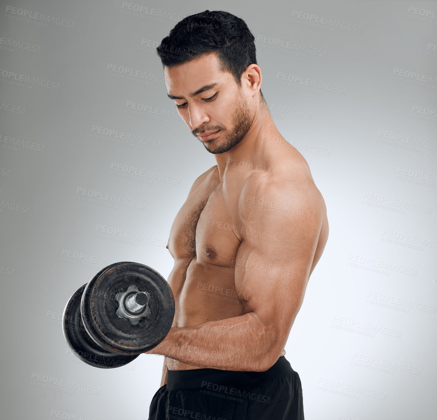 Buy stock photo Man, studio and dumbell for bicep curls or motivation, training or workout for sport. Male athlete, white background and energy with weight lifting in gym for goals, fitness or exercise for health