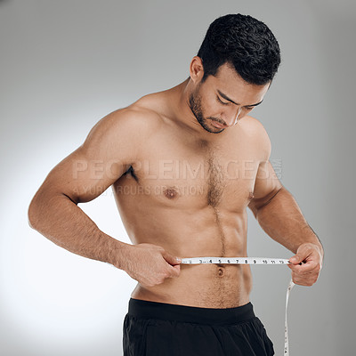 Buy stock photo Man, studio and measuring tape for exercise, weight loss and wellness with health and fitness. Guy, workout and results for training, body and diet with muscle and topless athlete on grey background