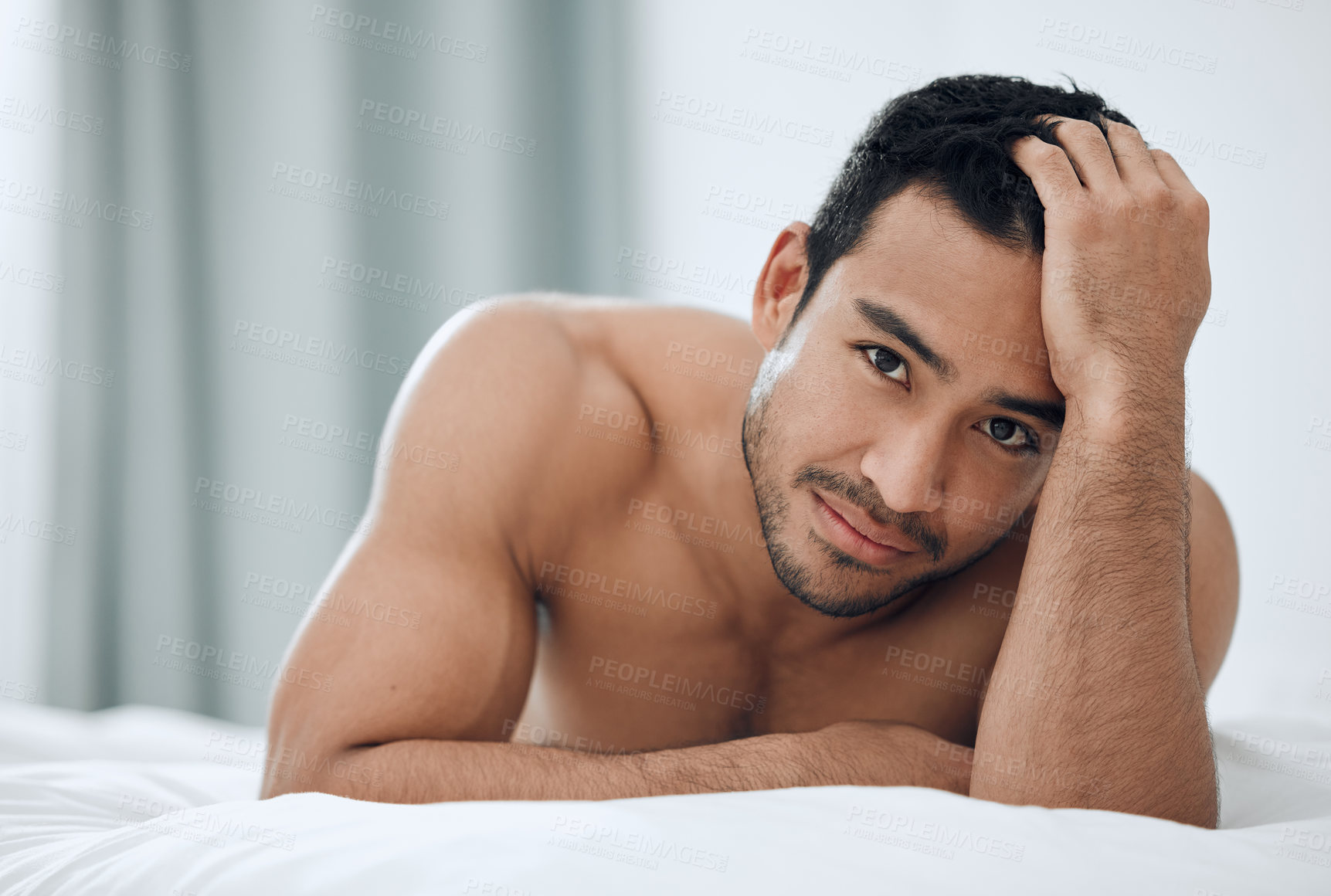 Buy stock photo Morning, portrait and man lying in bed with confidence for relax, wellness and wakeup in bedroom. Home, body and Asian male person with muscles for resting, comfortable or weekend break in apartment