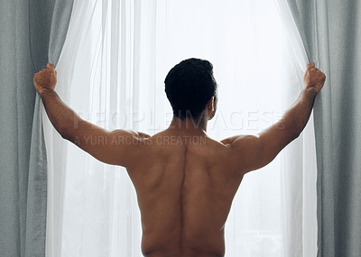 Buy stock photo Shot of a shirtless man opening the curtains at home