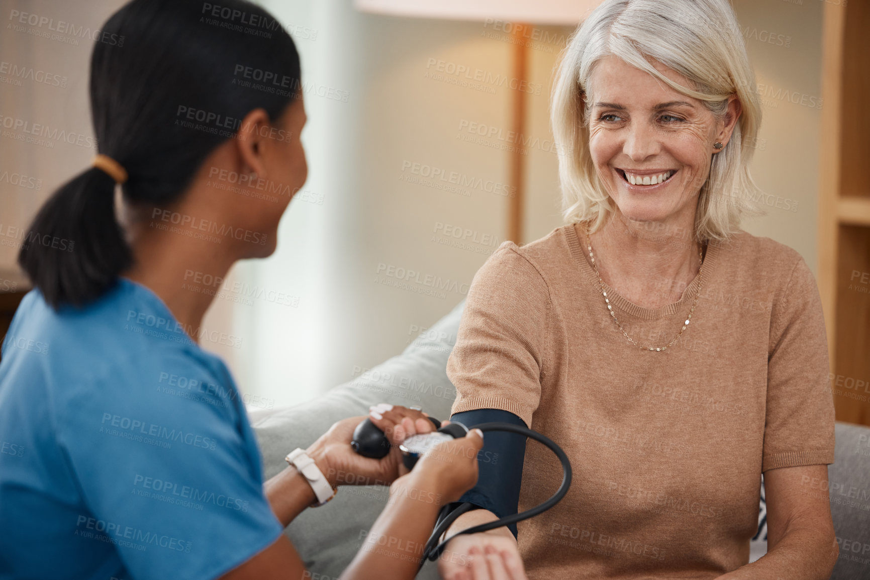 Buy stock photo Mature woman, nurse and blood pressure machine in cardiovascular, healthcare or wellness with happiness. People, medic and check for support, medicine or results as professional in clinic or hospital