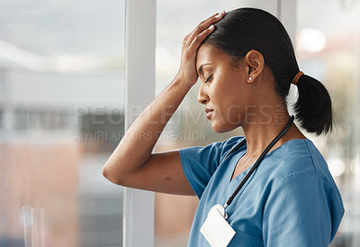 Buy stock photo Mental health, doctor with headache and stress standing at window at hospital. Burnout or overworked, anxiety or depression and female nurse or caregiver holding her head for migraine pain at clinic