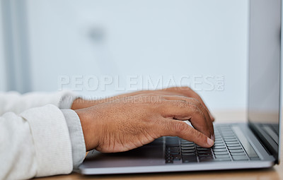 Buy stock photo Closeup shot of an unrecognisable businessman using a laptop in an office