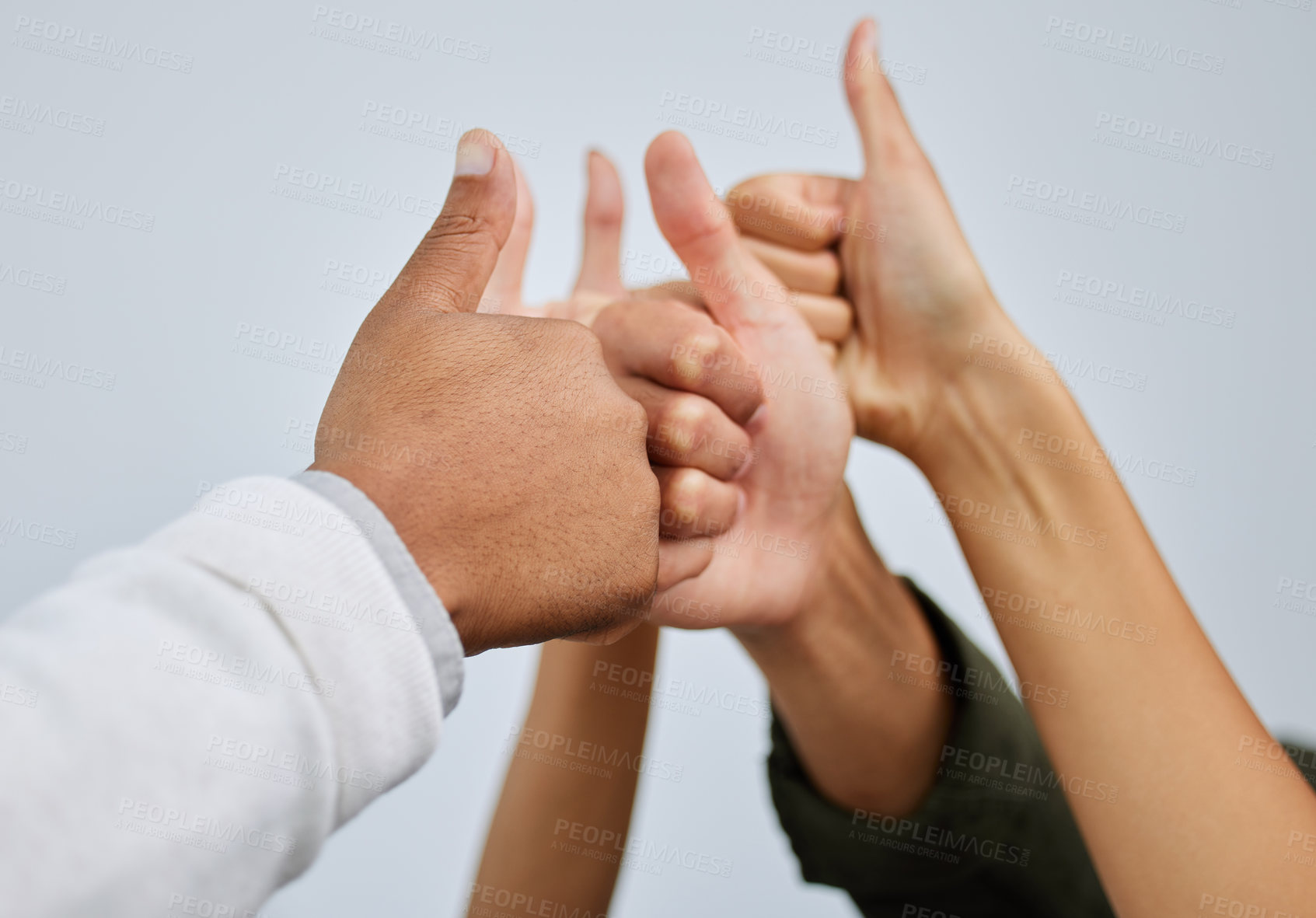 Buy stock photo Thumbs up, hands together and team of people in studio with unity, collaboration and partnership. Winning, pride and group of employees with satisfaction gesture for solidarity by gray background.