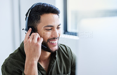 Buy stock photo Shot of a young male call center worker