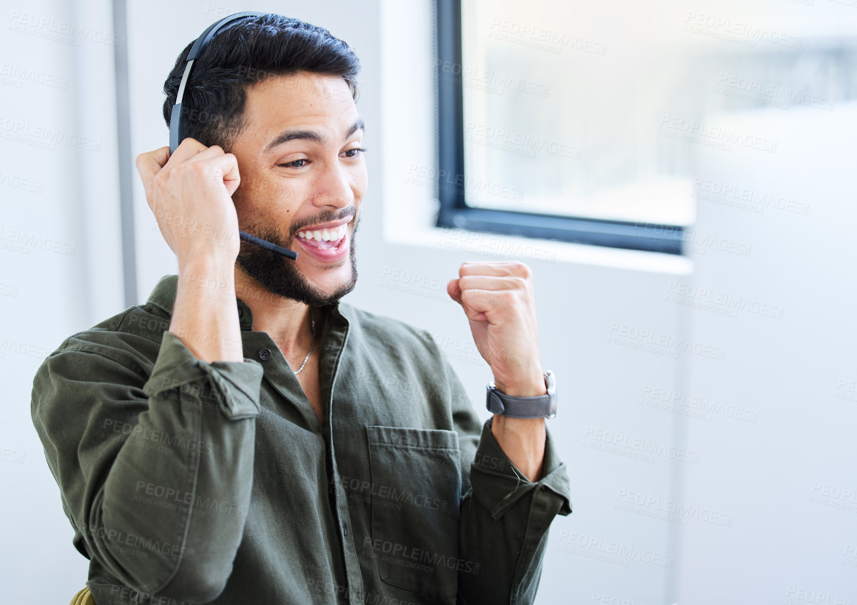 Buy stock photo Shot of a young male call center worker