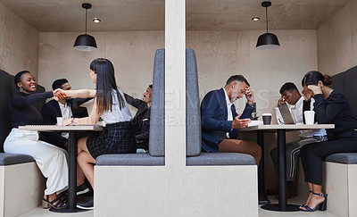Buy stock photo Shot of a group of coworkers working together in a cafe cubicle
