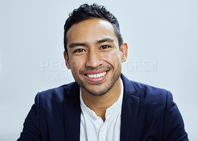 Buy stock photo Portrait of a young businessman against a white background