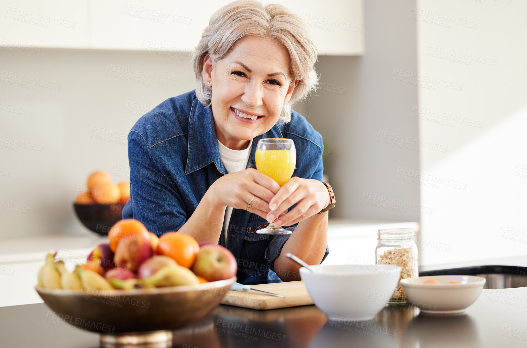 Buy stock photo Home, portrait and senior woman with juice for hydration, vitamin C and minerals. House, kitchen counter and elderly person with fruit beverage for breakfast, nutrition and happiness in retirement