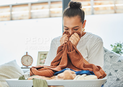 Buy stock photo Woman, smell and clean laundry clothes at house with fresh, fabric detergent and hygiene for disinfectant form bacteria. Relax, cleaner and comfort for aroma as housekeeping with washing fragrance