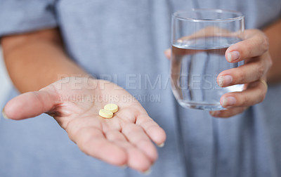 Buy stock photo Home, water and hands of person with pills, vitamins and supplements as medication. House, patient and tablets as prescription for health, wellness and illness treatment for symptoms management