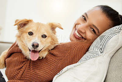 Buy stock photo Portrait of a beautiful young woman relaxing on the couch with her dog at home