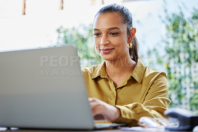 Buy stock photo Cropped shot of an attractive young woman businesswoman working on her laptop at home