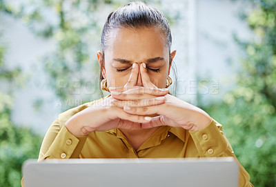 Buy stock photo Cropped shot of an attractive young businesswoman looking stressed while working on her laptop at home