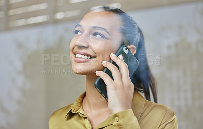 Buy stock photo Cropped shot of an attractive young businesswoman making a phonecall while working from home