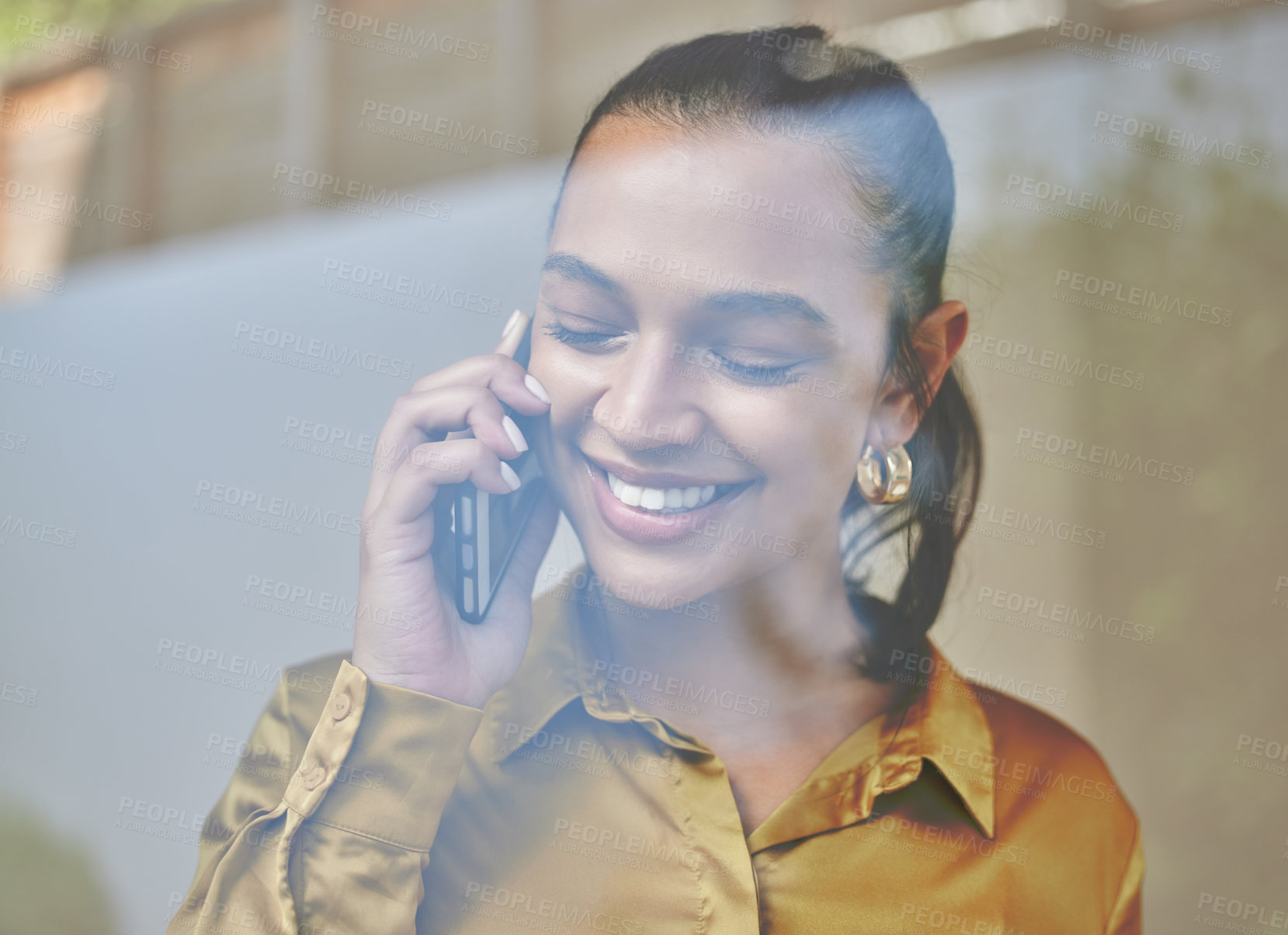 Buy stock photo Cropped shot of an attractive young businesswoman making a phonecall while working from home