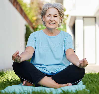 Buy stock photo Shot of a senior woman doing yoga outside in her yard