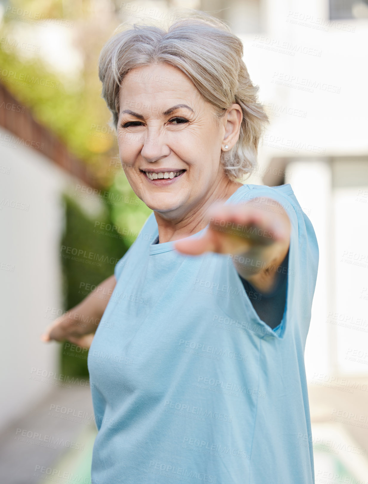 Buy stock photo Shot of a senior woman doing yoga outside in her yard