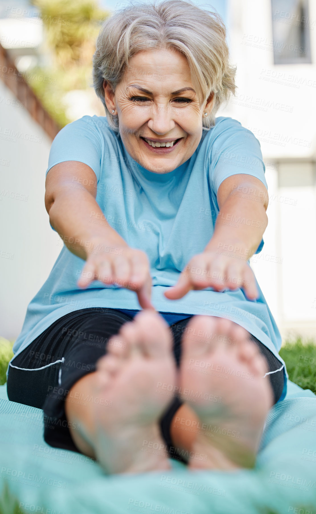 Buy stock photo Shot of a senior woman doing yoga outside in her yard