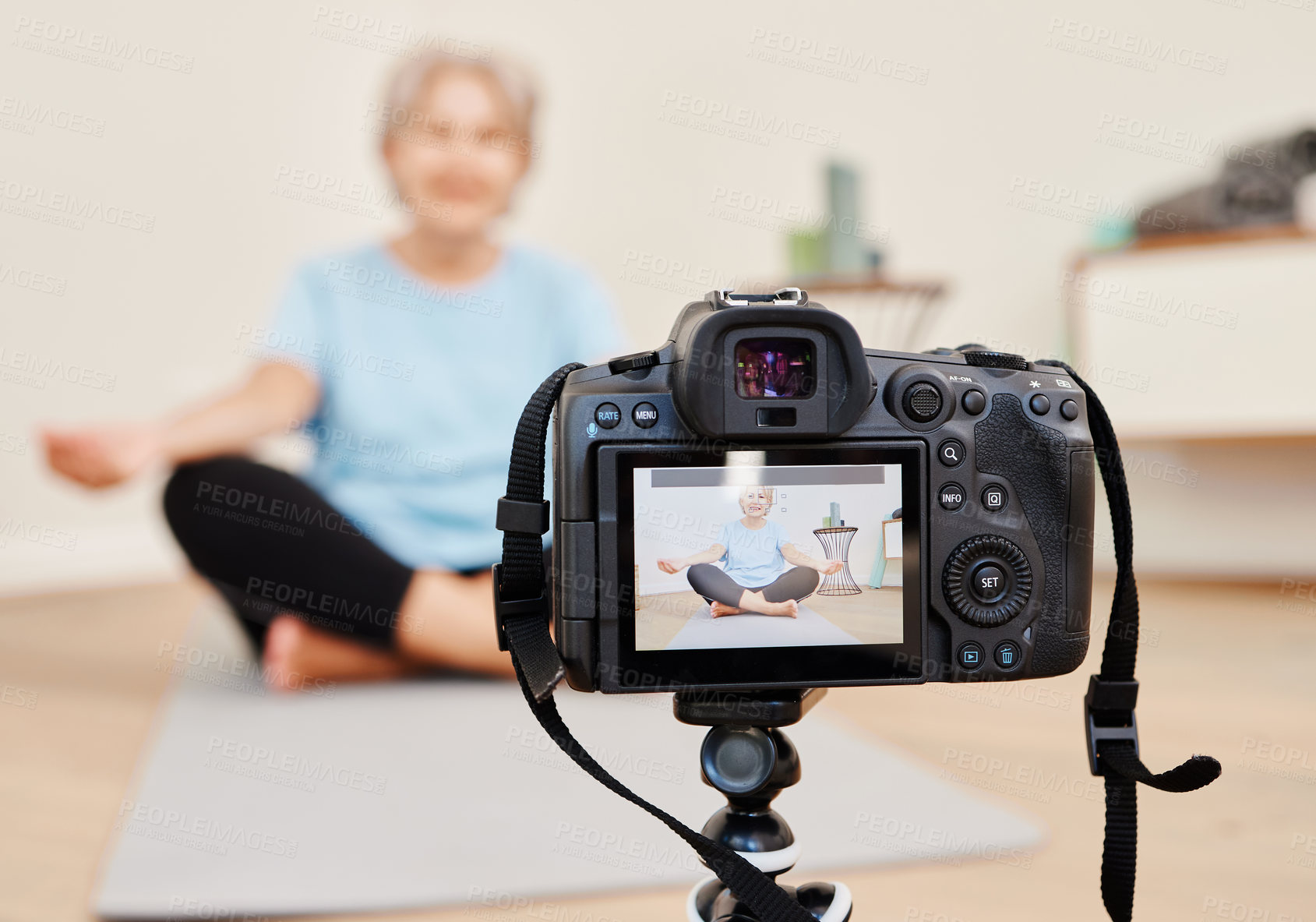 Buy stock photo Woman, lotus or lesson with filming of yoga in home, sitting on mat for mindset with peace tutorial. Female person, zen or health with recording for wellness in house on floor, exercise for streaming