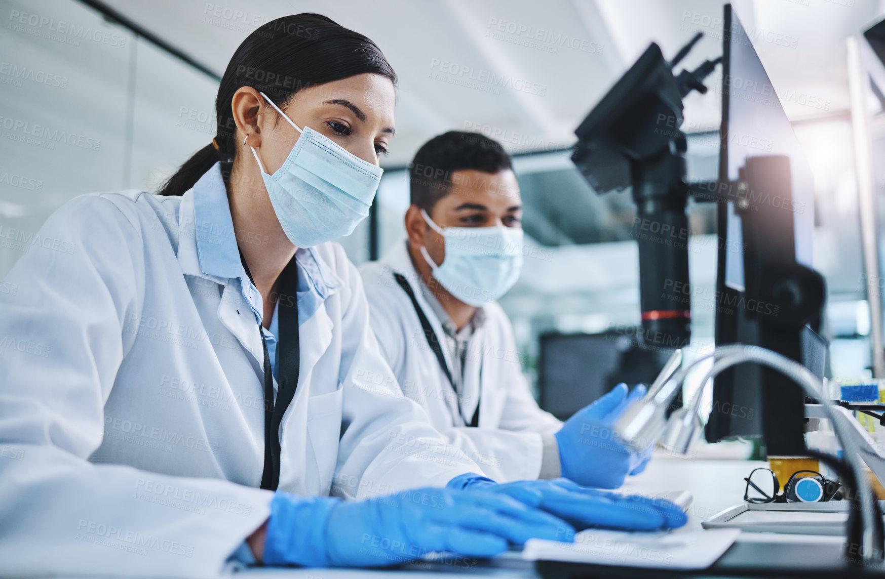 Buy stock photo Science, biotechnology and scientists in a laboratory working on research for a medical project. Face mask, equipment and healthcare researchers with a pharmaceutical experiment, test or analysis.