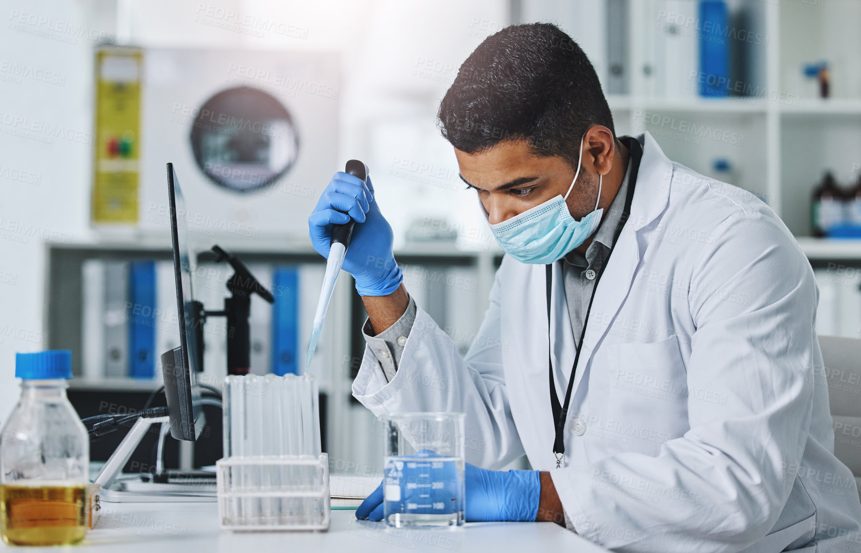 Buy stock photo Science man, pipette and test tube in lab medical, pharmaceutical or covid research in face mask. Young male scientist, innovation and development for test, check or medicine for virus in laboratory