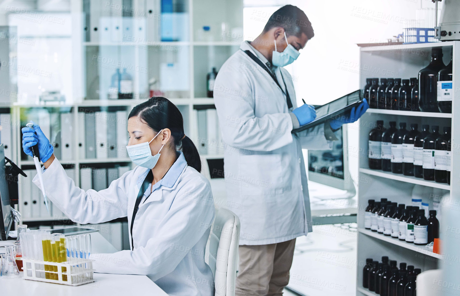 Buy stock photo People, face mask and science or research team, medical laboratory and innovation or healthcare employee. Vaccine, pharmaceutical study and chemical experiment, test tube and scientists with lab coat