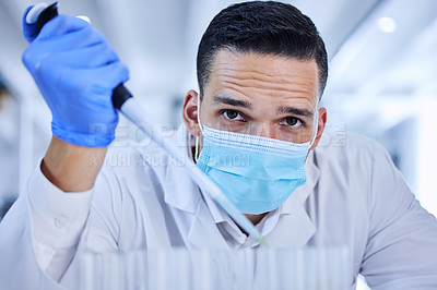 Buy stock photo Cropped portrait of a handsome young male scientist working in his lab