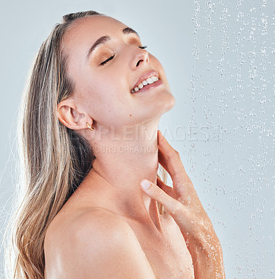 Buy stock photo Shot of a young woman taking a shower