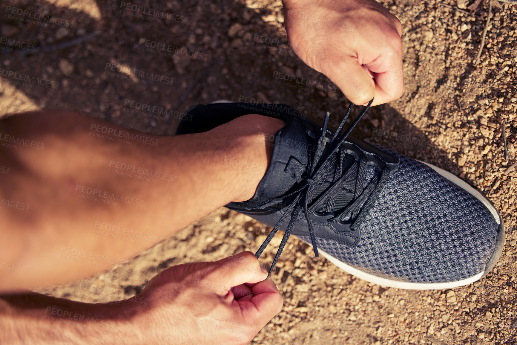 Buy stock photo Top view, hands and runner tie shoes outdoor to start running, exercise or workout. Hand, athlete and man tying sneakers to get ready for cardio, training or exercising for sports, health and fitness