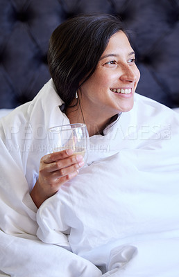 Buy stock photo Woman, coffee and smile in bed or thinking of wellness, hydration or detox for sleep in home. Girl, person and happy in bedroom with chamomile tea for insomnia, health idea or digestion in Naples