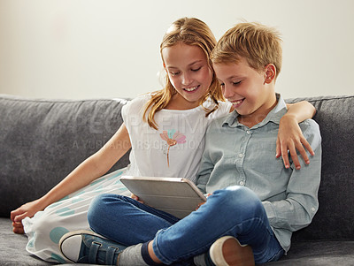 Buy stock photo Children, smile and tablet on sofa for gamification, learning and development for online movies or virtual games. kids, hug and digital tech in lounge for video, streaming and happy for internet