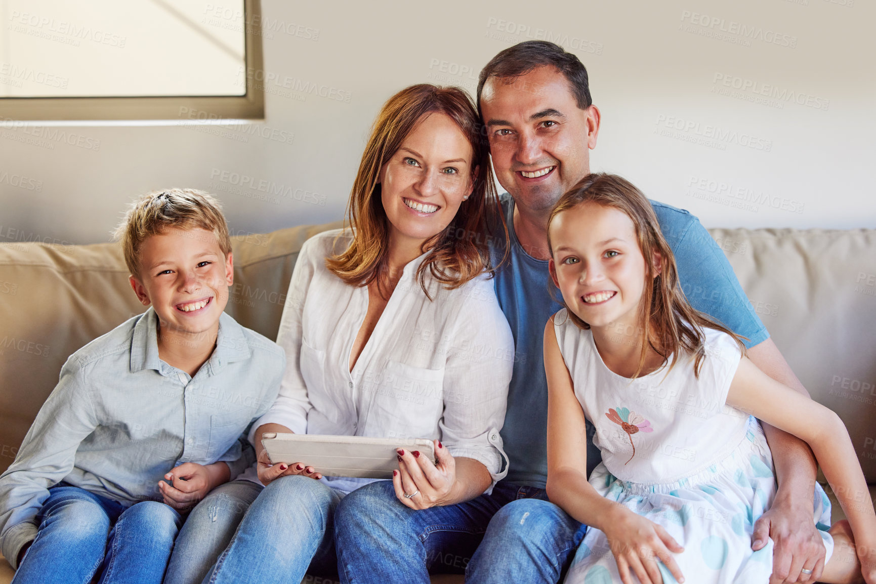 Buy stock photo Smile, sofa and portrait of family with tablet in living room for communication, streaming and movie. Mother, father and children with tech at home for bonding, childhood development and online film