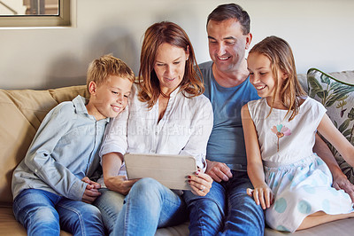 Buy stock photo Home, movie and family with tablet on sofa for online search, digital streaming and network. Father, mother and kids with technology in house for bonding, childhood development and film subscription