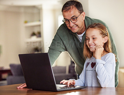 Buy stock photo Father, girl and laptop for remote education in home, internet and school website or online homework. Daddy, daughter and help with lesson at table, support and studying or teaching child to learn