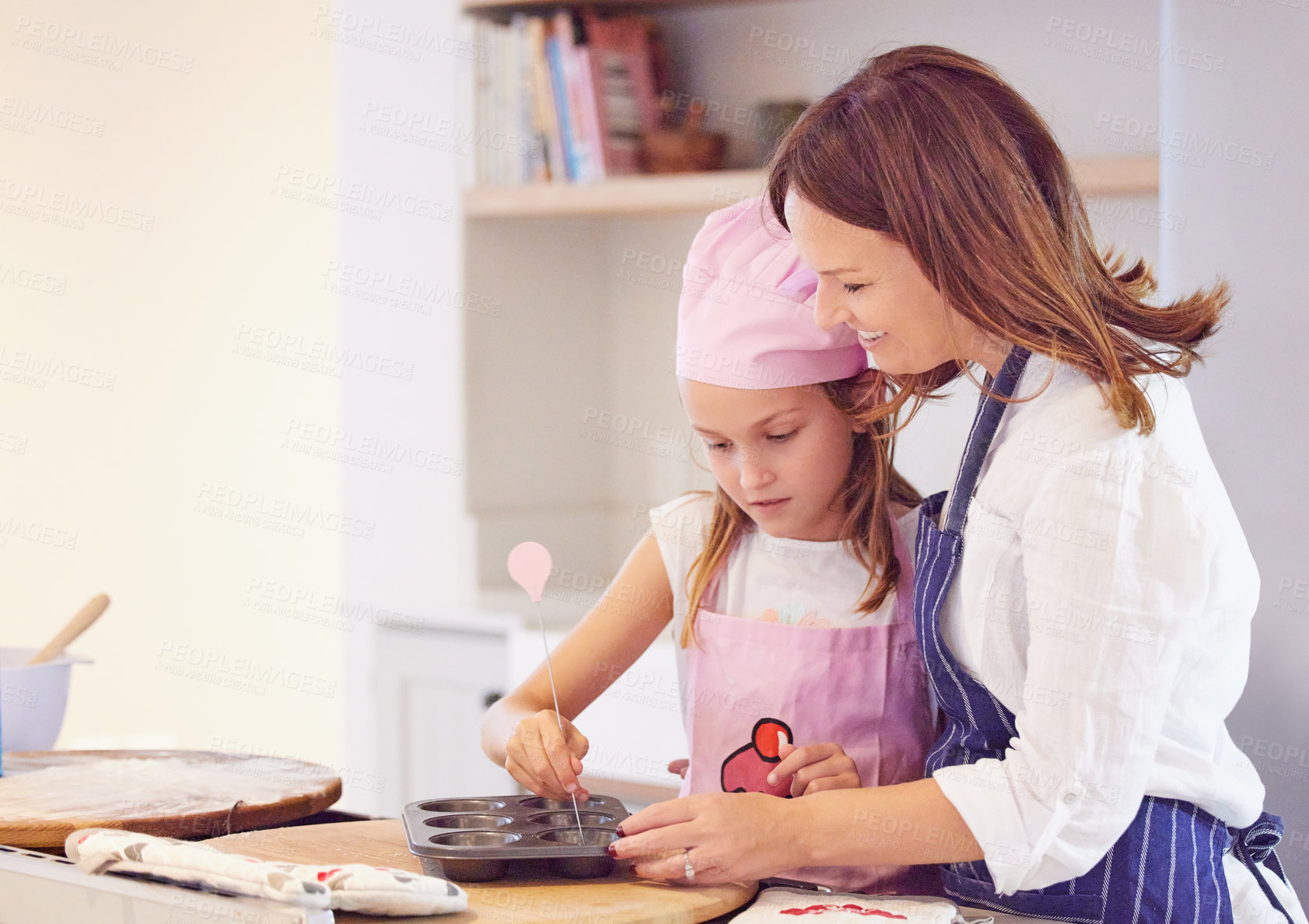 Buy stock photo Baking, family and tray in kitchen of home together learning how to cook or prepare fresh pastry. Equipment, smile or happy with mother and daughter in apartment to bake ingredients, food or recipe