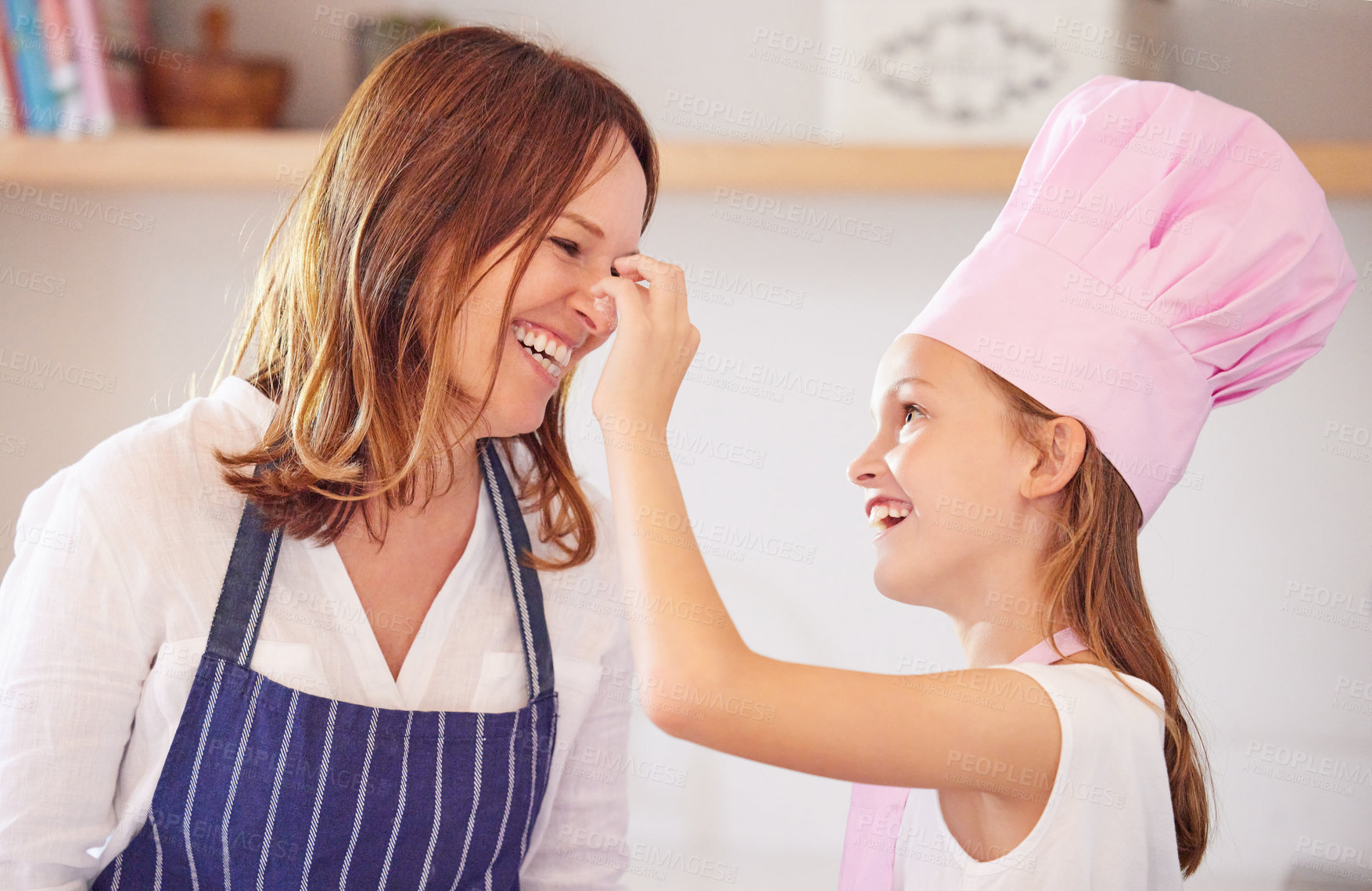 Buy stock photo Mother, girl and nose play while baking in kitchen, support and child learning to prepare cookies. Happy daughter, mama and pastry education in home, love and bonding while cooking snacks or dessert