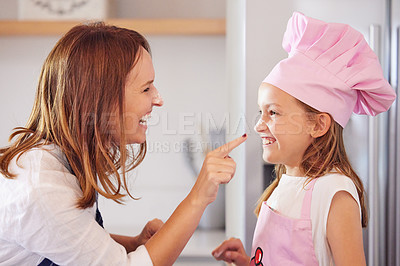 Buy stock photo Mother, girl and flour for nose touch or baking in kitchen, support and learning to prepare cookies.  Daughter, mama and pastry education in home, love and bonding while cooking snacks or dessert