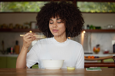 Buy stock photo Shot of a young woman having lunch in the kitchen at home