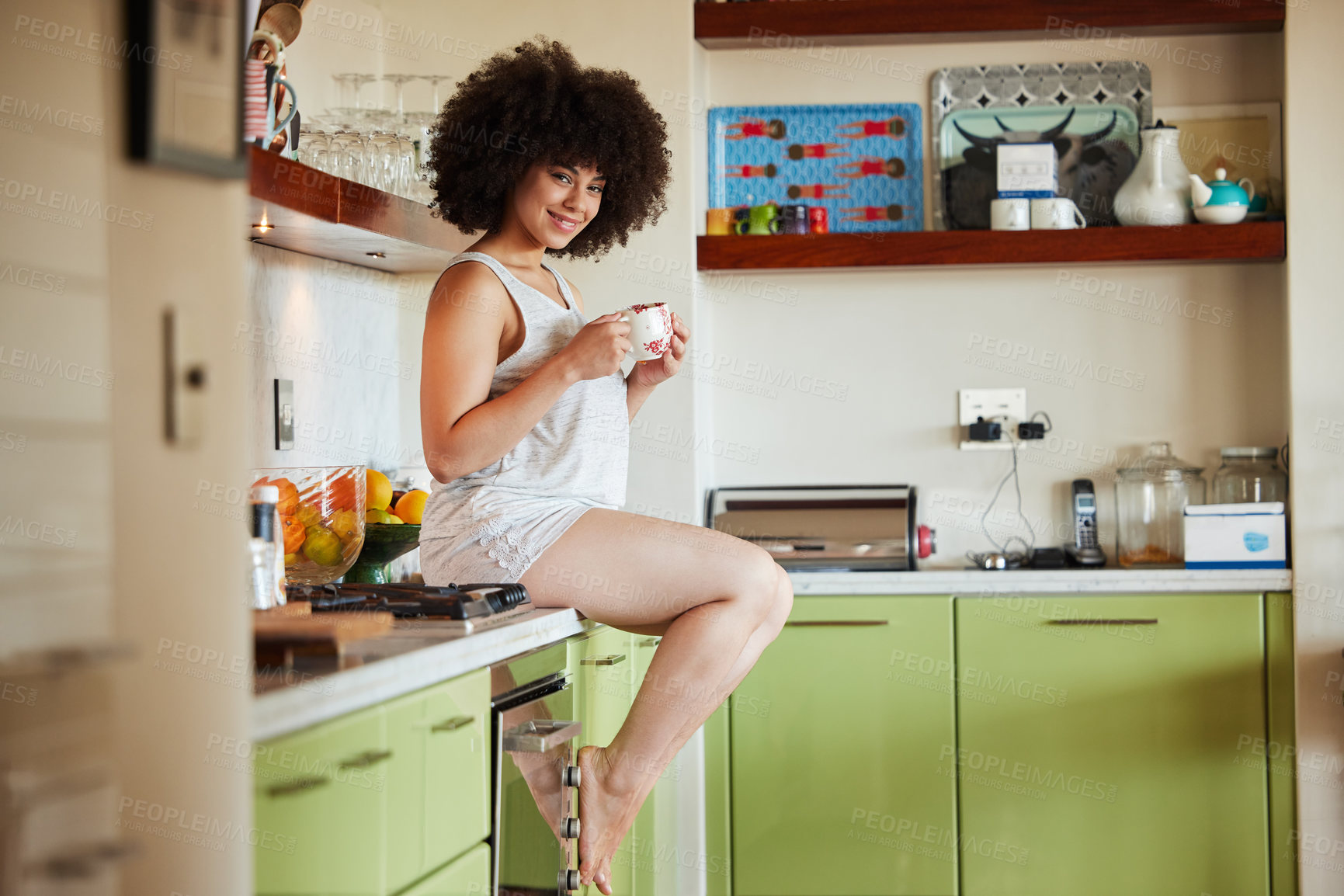 Buy stock photo Portrait of an attractive young woman have a cup of coffee in the kitchen at home