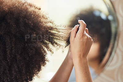 Buy stock photo Hair care, woman with afro and comb in mirror for bathroom routine, beauty and morning grooming in home. Haircare, reflection and African model brushing curls from the back, combing curly hairstyle.