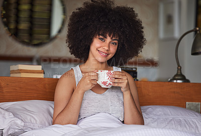 Buy stock photo Portrait of a beautiful  young woman having a cup of coffee in bed at home