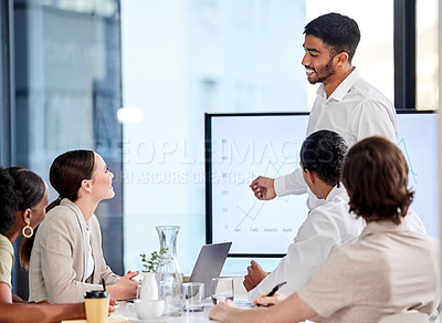 Buy stock photo Shot of a young man giving a presentation in a modern office