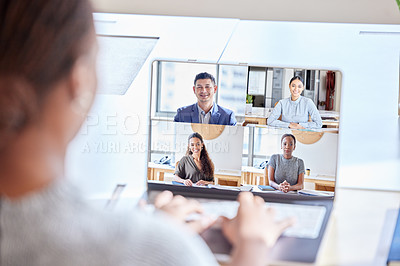 Buy stock photo Shot of an unrecognizable businesswoman on a videocall at work