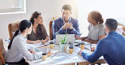 Buy stock photo Shot of a group of colleagues having a meeting in a boardroom at work
