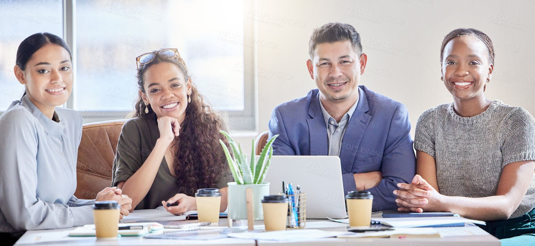 Buy stock photo Shot of a group of colleagues having a meeting in a boardroom at work