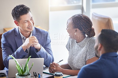 Buy stock photo Shot of a group of colleagues having a meeting in a boardroom at work