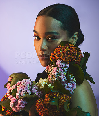 Buy stock photo Neon, portrait and woman with flowers in studio for beauty, cosmetics and makeup with bouquet. Face, female person and pride by backdrop for glow, art deco and foundation with plant for aesthetic 