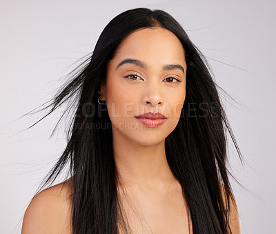 Buy stock photo Woman, portrait and hair care with wind in studio for growth, keratin treatment or shampoo on white background. Hairstyle, aesthetic and confident model for satisfaction, cosmetics or glowing texture