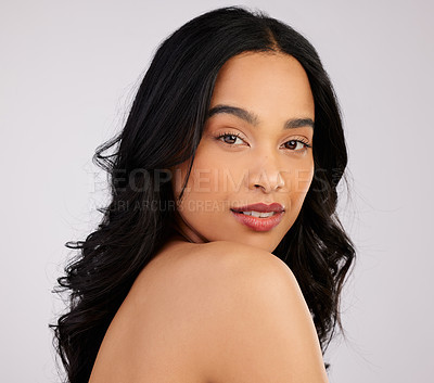 Buy stock photo Studio shot of a beautiful young woman posing against a grey background